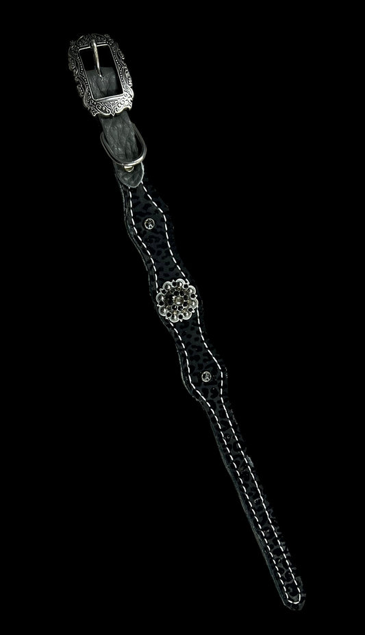 Black flocked leopard on dark leather