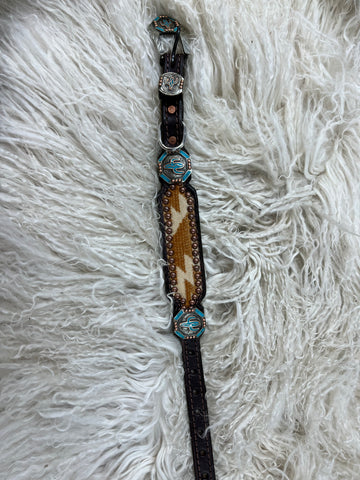 Turquoise and rust wool on dark leather