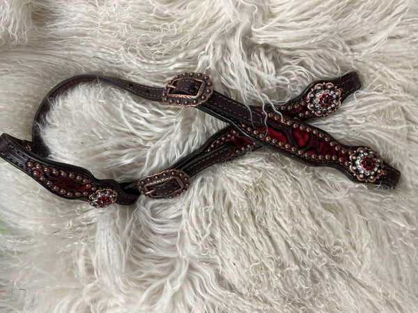 Red roses on dark leather
