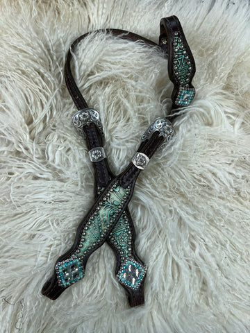 Turquoise and mint paisley on dark leather is