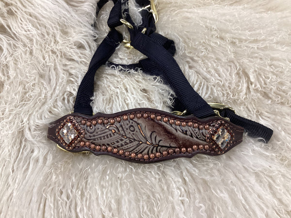 chocolate feathers on dark leather